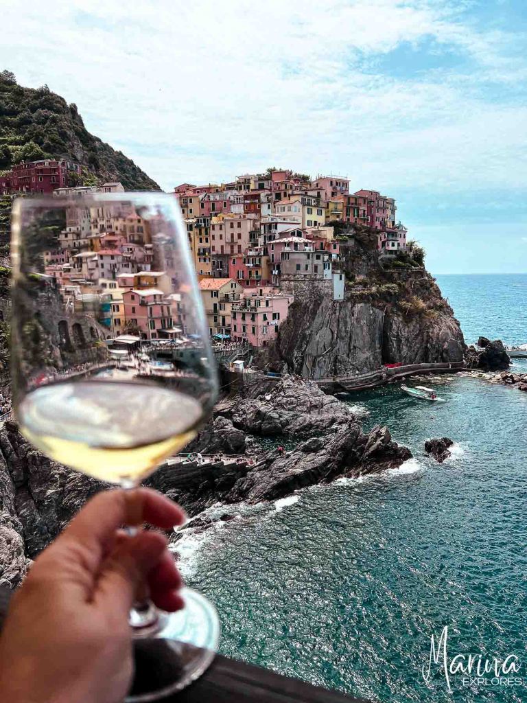 Pesto experience at Nessun Dorma, Manarola, harbor and wine glass, Cinque Terre, Italy