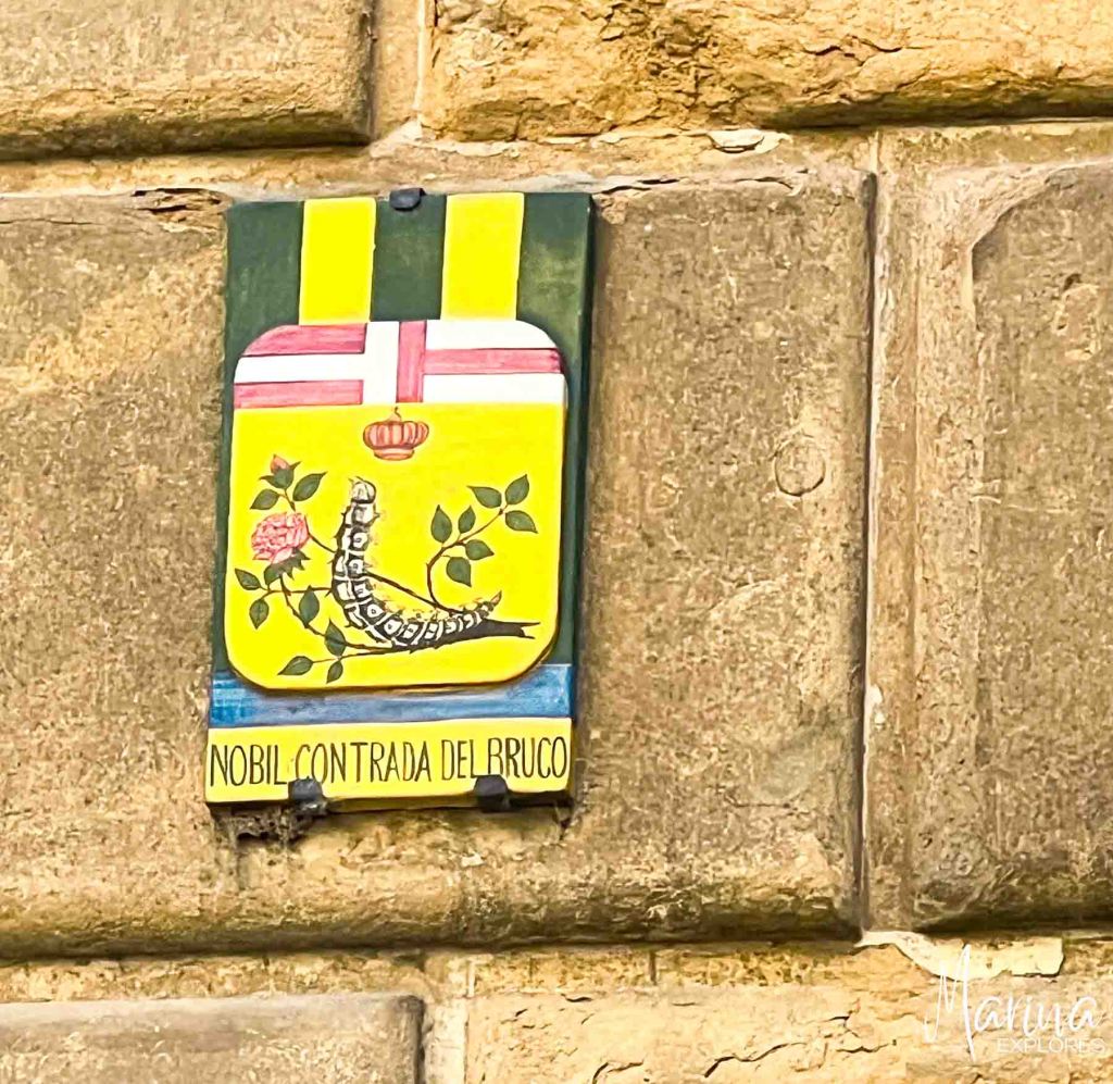 Contrade sign on wall of Siena near Florence, Italy