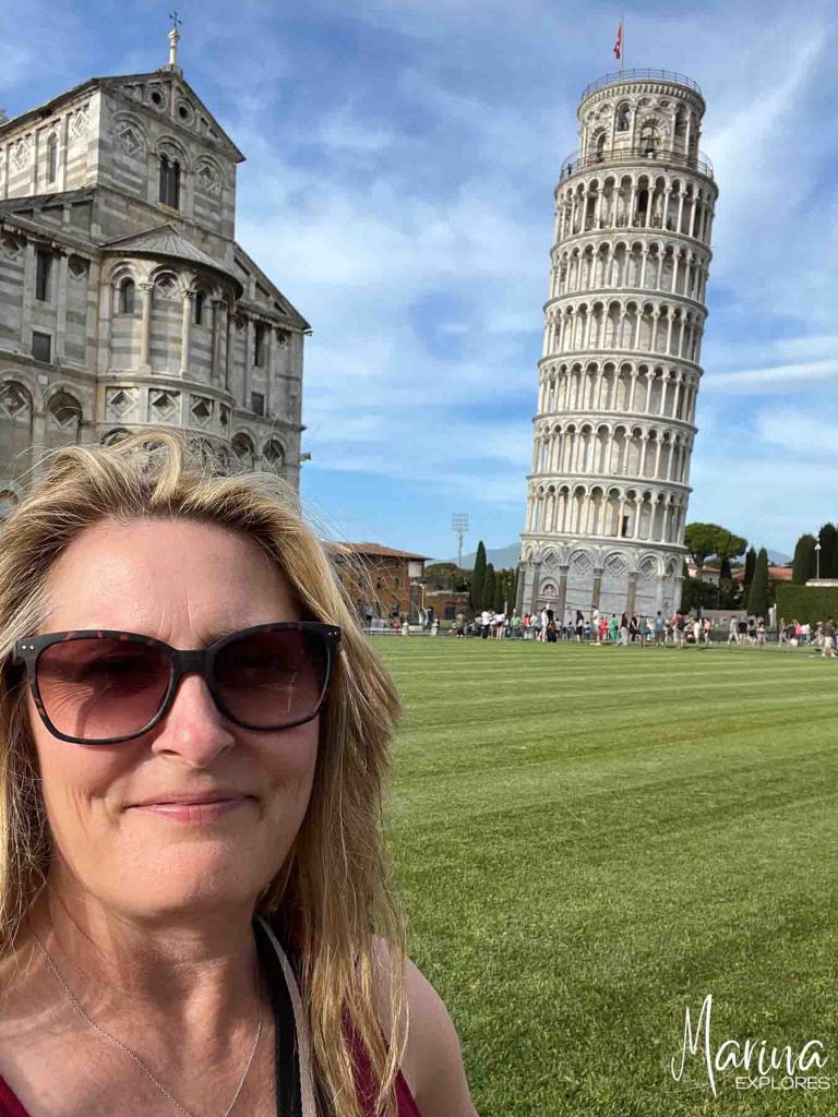 Leaning tower of Pisa with Marina in front in Florence, Italy