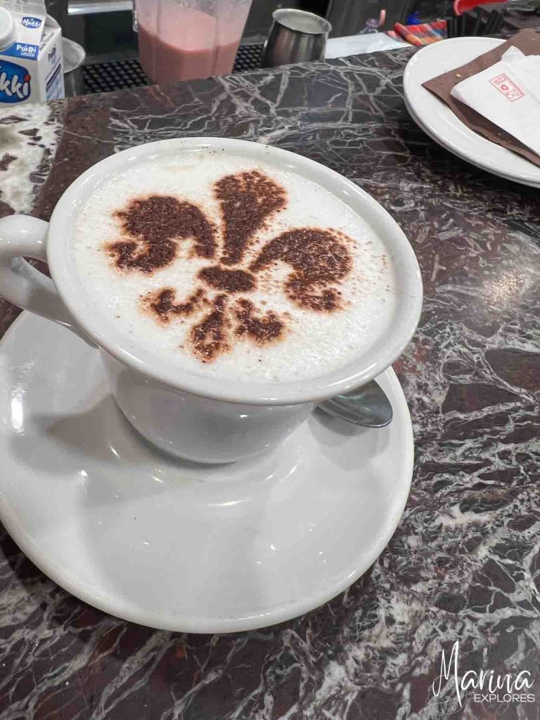 Cappuccino with symbol of Florence on top in Florence, Italy