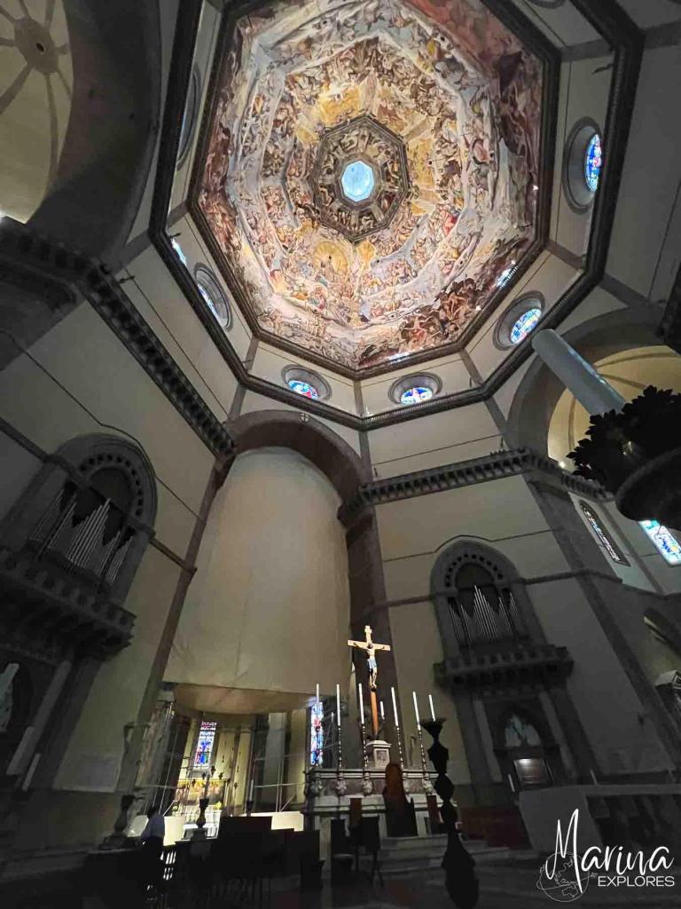 Looking up at dome from interior of Duomo in Florence, Italy