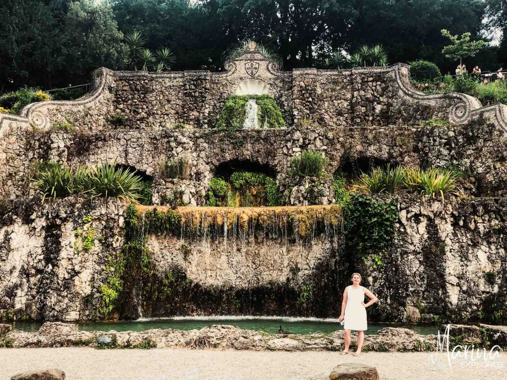 Marina posing in front of fountain on walk up to Piazzale Michelangelo in Florence, Italy