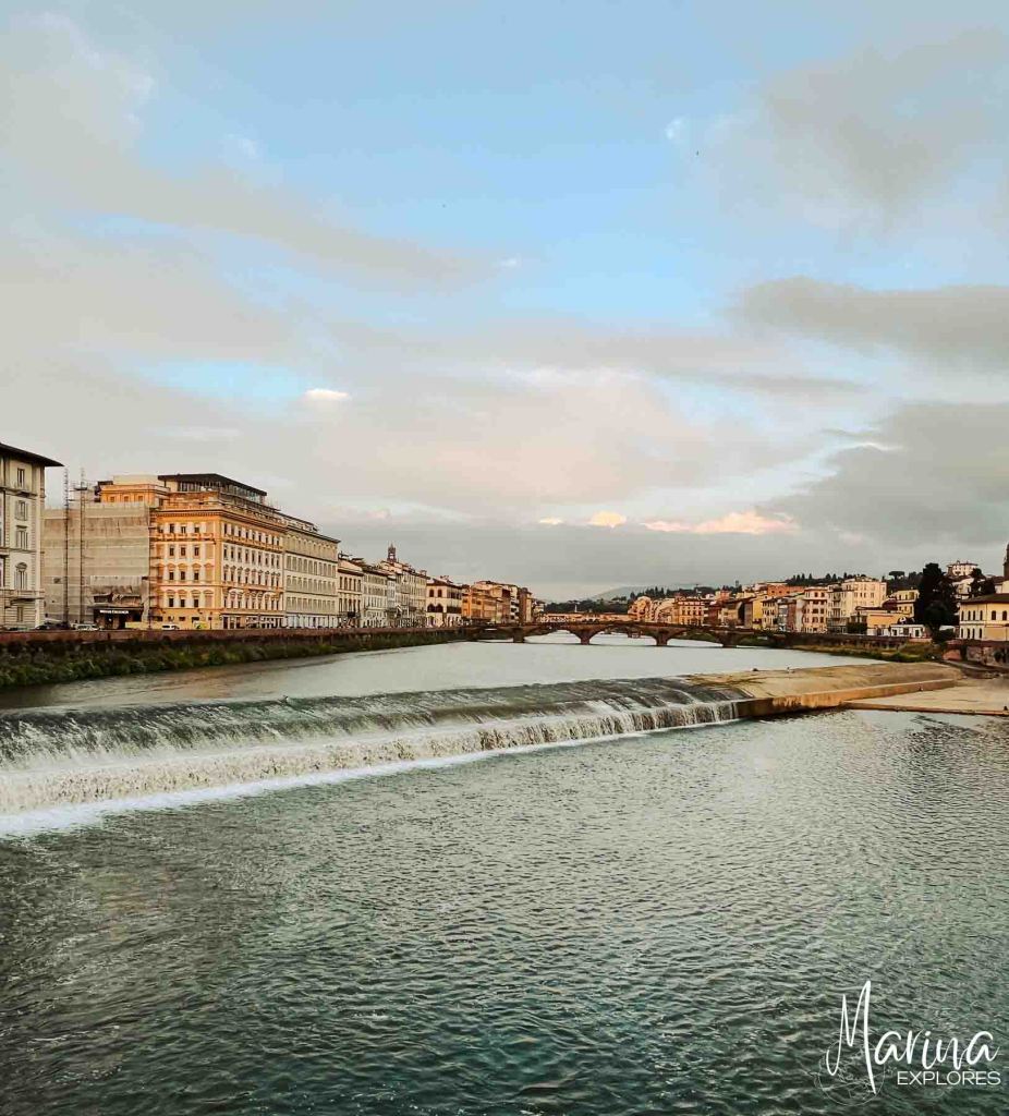 Looking up Arno River and bridge in Florence, Italy