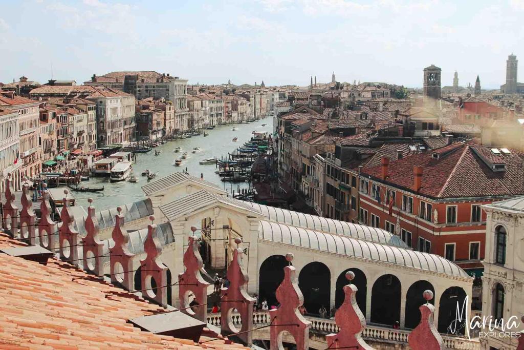 View of Grand Canal from rooftop terrace looking towards lagoon Rialto Bridge in foreground Venice, Italy