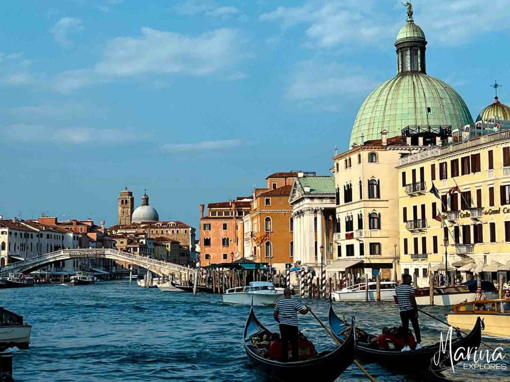 View of Grand Canal with gondolas in foreground and Rialto Bridge in distance Venice, Italy