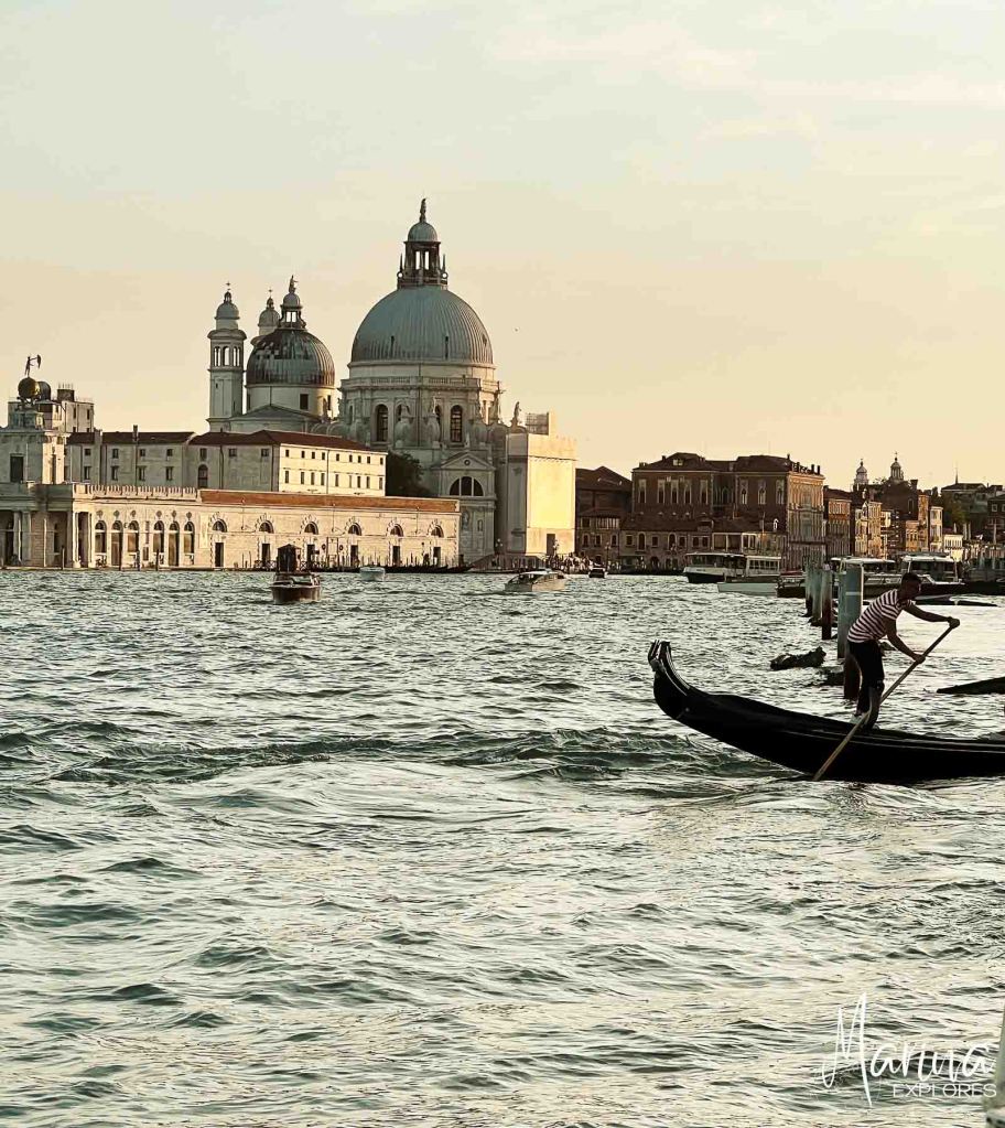 San Giorgio Maggiore church gondola in foreground at sunset Venice, Italy