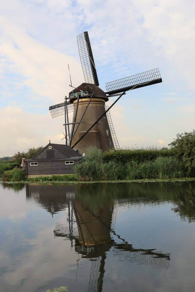 windmill reflecting on still canal